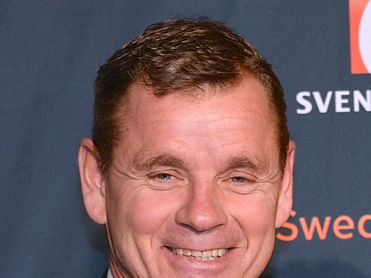 Håkan Loob ler mot kameran vid ett offentligt evenemang